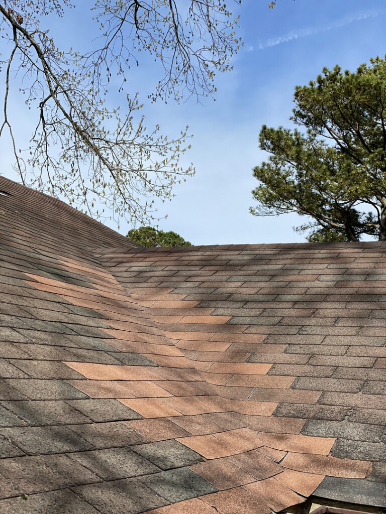 roof repair, new shingles placed in peak of roof